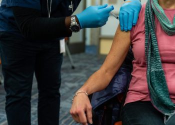 There’s a racial gap on covid vaccine — because of the partisan gap