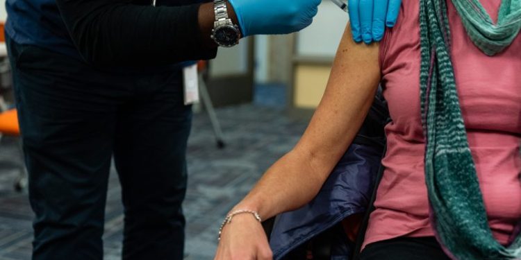 There’s a racial gap on covid vaccine — because of the partisan gap