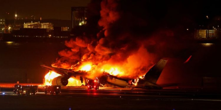 Japan Airlines jet bursts into flames after collision with earthquake relief plane at Tokyo Haneda airport