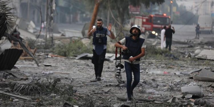 Palestinians are documenting the war for millions on social media. Their followers have come to see them as family.