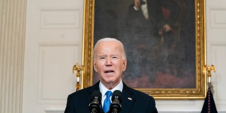 Biden faults Trump’s vaccine rollout as he cites total covid death toll