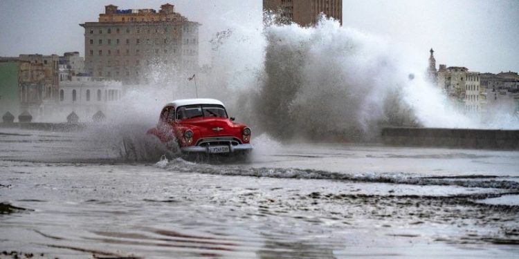 Huge waves and high winds hurl jellyfish and seaweed into the streets of Havana
