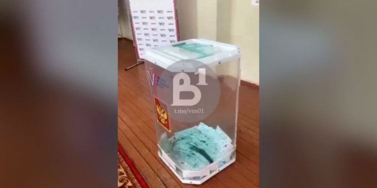 Russia opens criminal cases after protesters pour dye in ballot boxes and start fires with voting underway