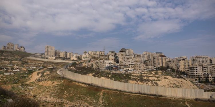 Palestinian boy with firework, 12, shot dead by Israeli border police at east Jerusalem refugee camp