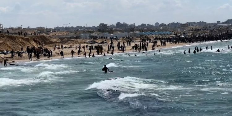 At least 12 Palestinians drown trying to retrieve aid parcels dropped into the sea