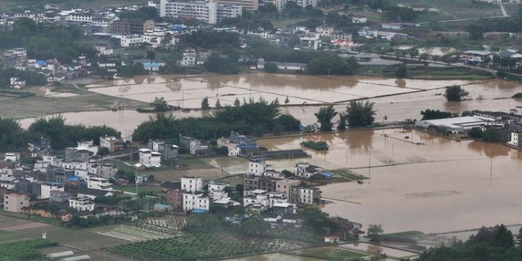 Massive floods threaten tens of millions as intense rains batter southern China