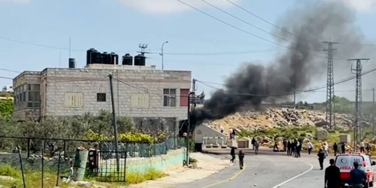 Hundreds of Israeli settlers attack Palestinian villages in the occupied West Bank after missing Israeli boy found dead
