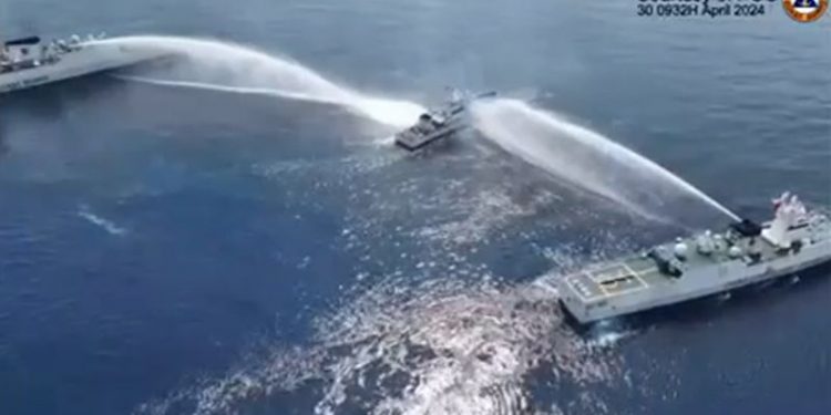 Chinese water cannon damages ship in new South China Sea flare-up, Philippines says