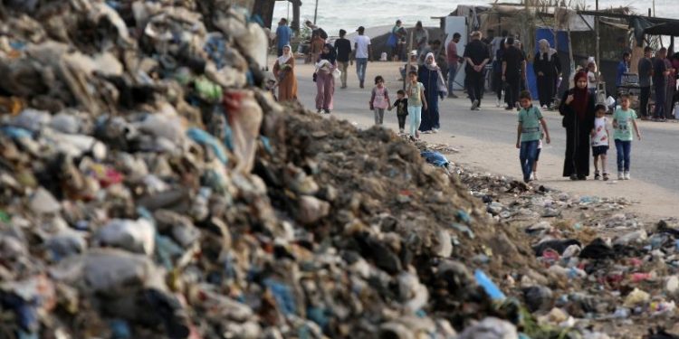 Flies, mosquitoes, raw sewage and mountains of garbage threaten to worsen Gaza’s health crisis