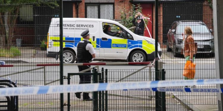 Man charged with double murder after human remains found in suitcases on UK bridge