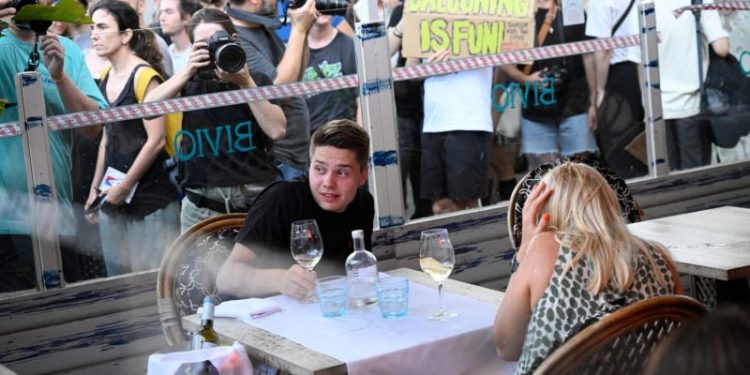 Barcelona protesters throw items and spray travelers with water while shouting ‘tourists go home’