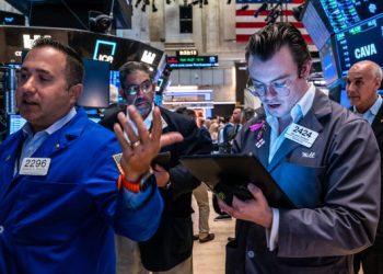 Dow rises 200 points to close at a record