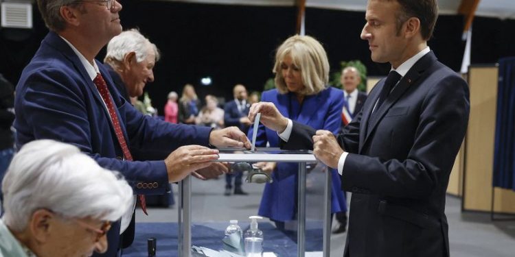 Macron urges new mainstream coalition, appearing to rule out working with the far left