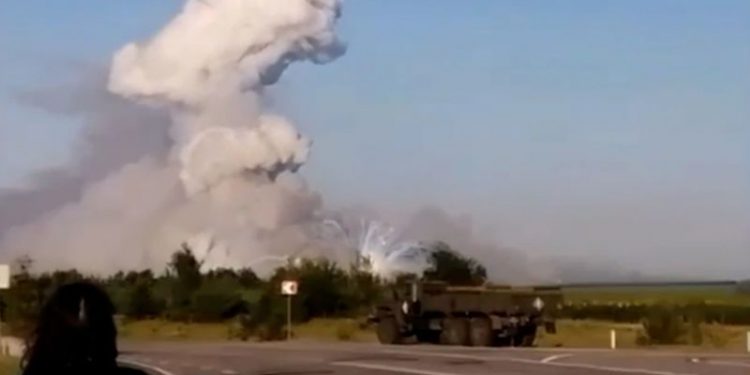 Russia vows to respond after Ukrainian drone attack sets on fire alleged munitions warehouse