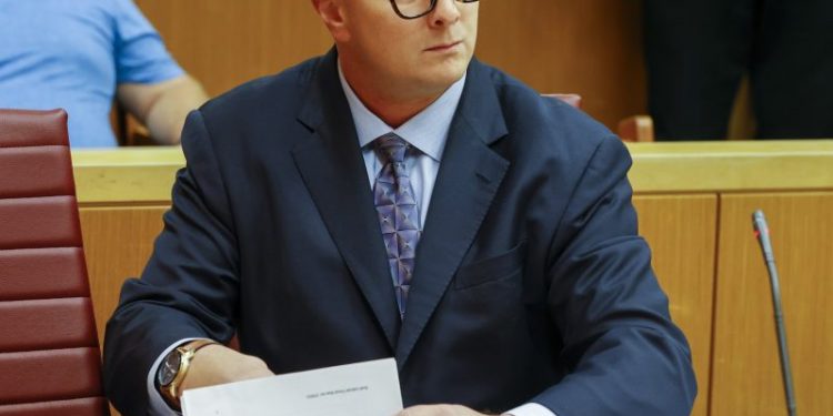 Ex-congressional candidate charged with threatening ‘hit squad’ against opponent