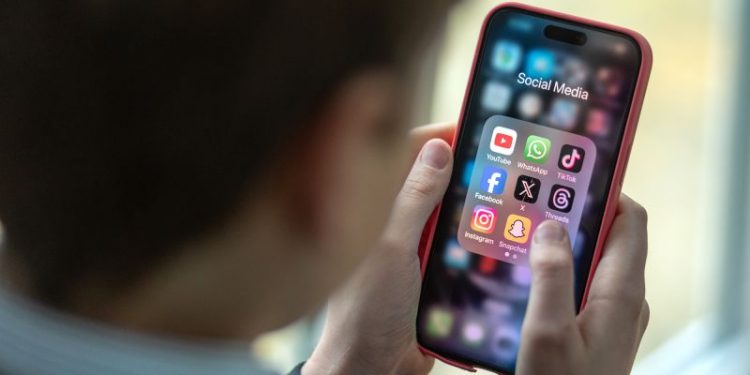 Australia tables bill to limit under-16s from using social media with tech companies facing huge fines