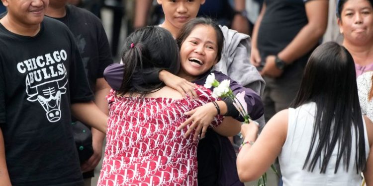 Filipina spared from execution in Indonesia returns home after 14 years on death row