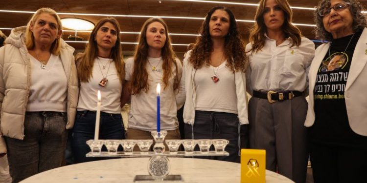 Israeli hostage families light first candle of Hanukkah, marking start of second holiday without loved ones