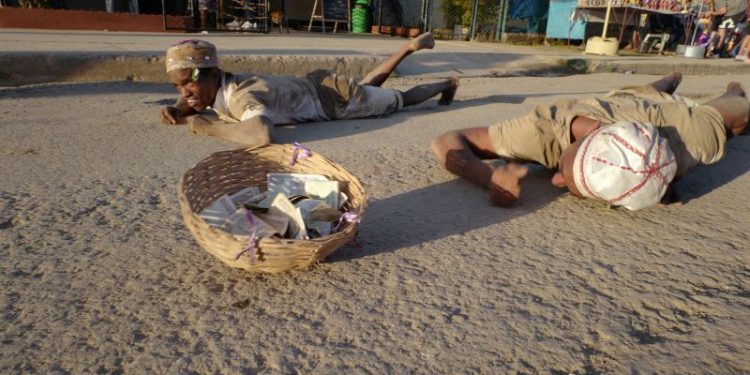 Cubans crawl on rough roads to ask for good fortune