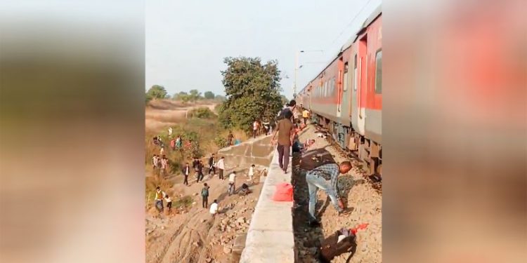 Rail accident kills 12 in western India after passengers jump onto tracks over fire alert
