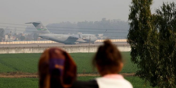 At least 104 Indian citizens deported from US on military aircraft, say Indian officials