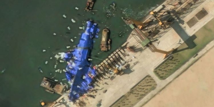 North Korea deploys mystery balloon-like objects to stricken warship, satellite photos show