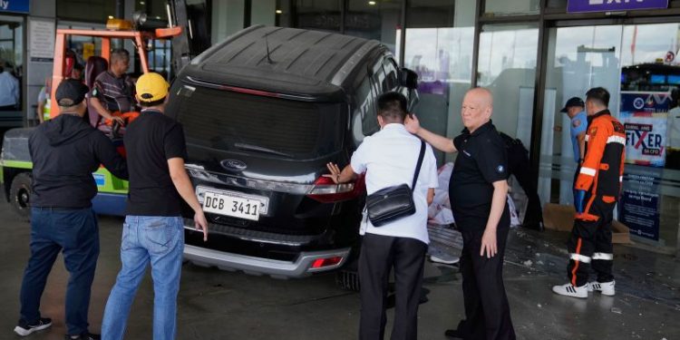 Four-year-old girl and man dead after driver crashes SUV into Manila airport, Red Cross says