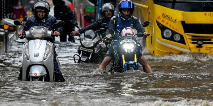 Floods wreak havoc on India’s financial capital as monsoon rains arrive early